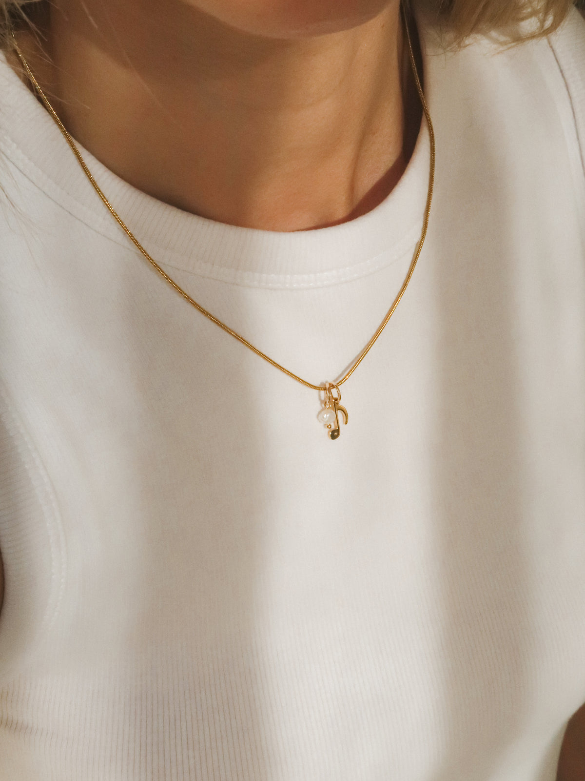 Mini pearl charm