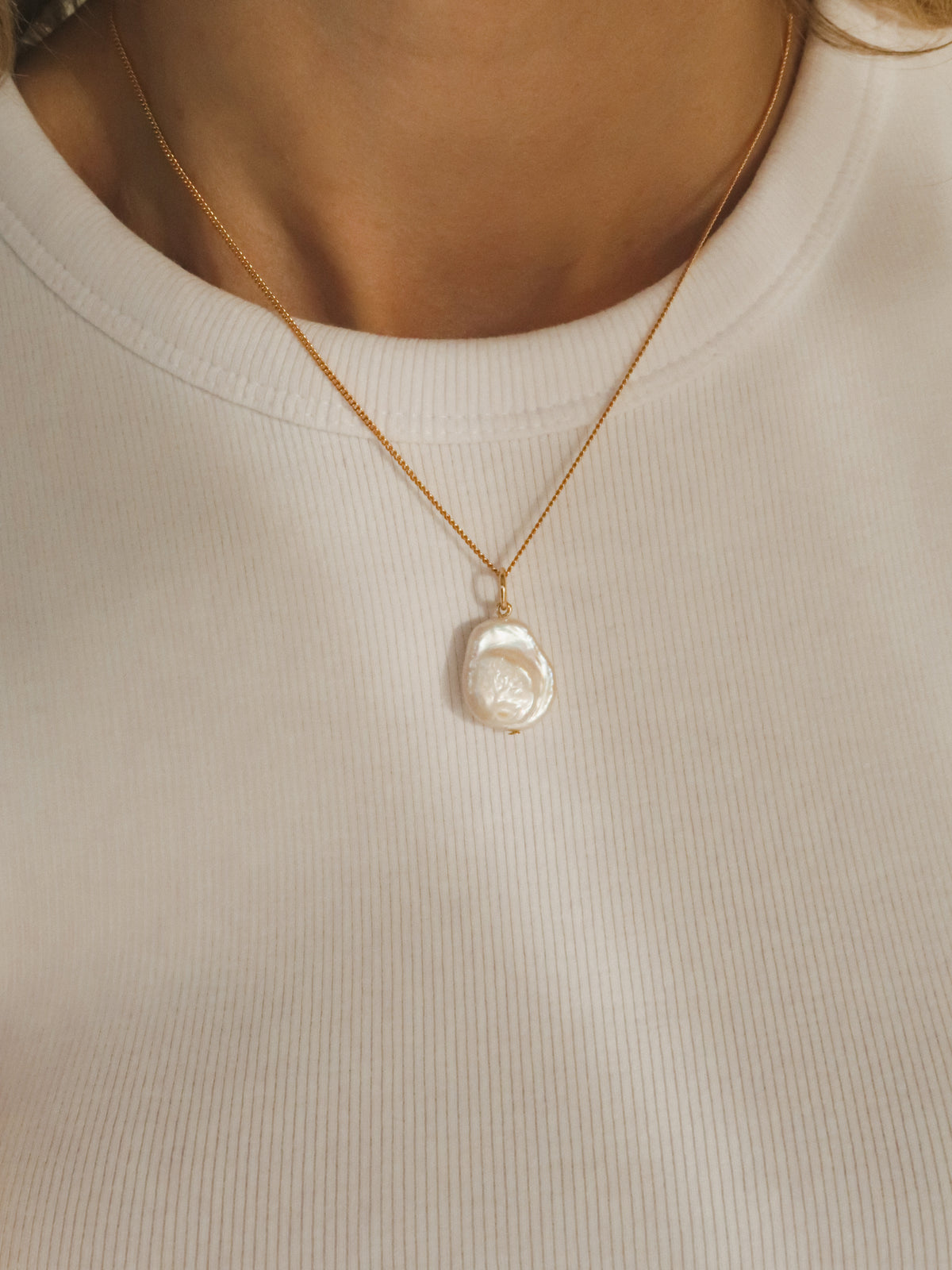 Flat pearl charm