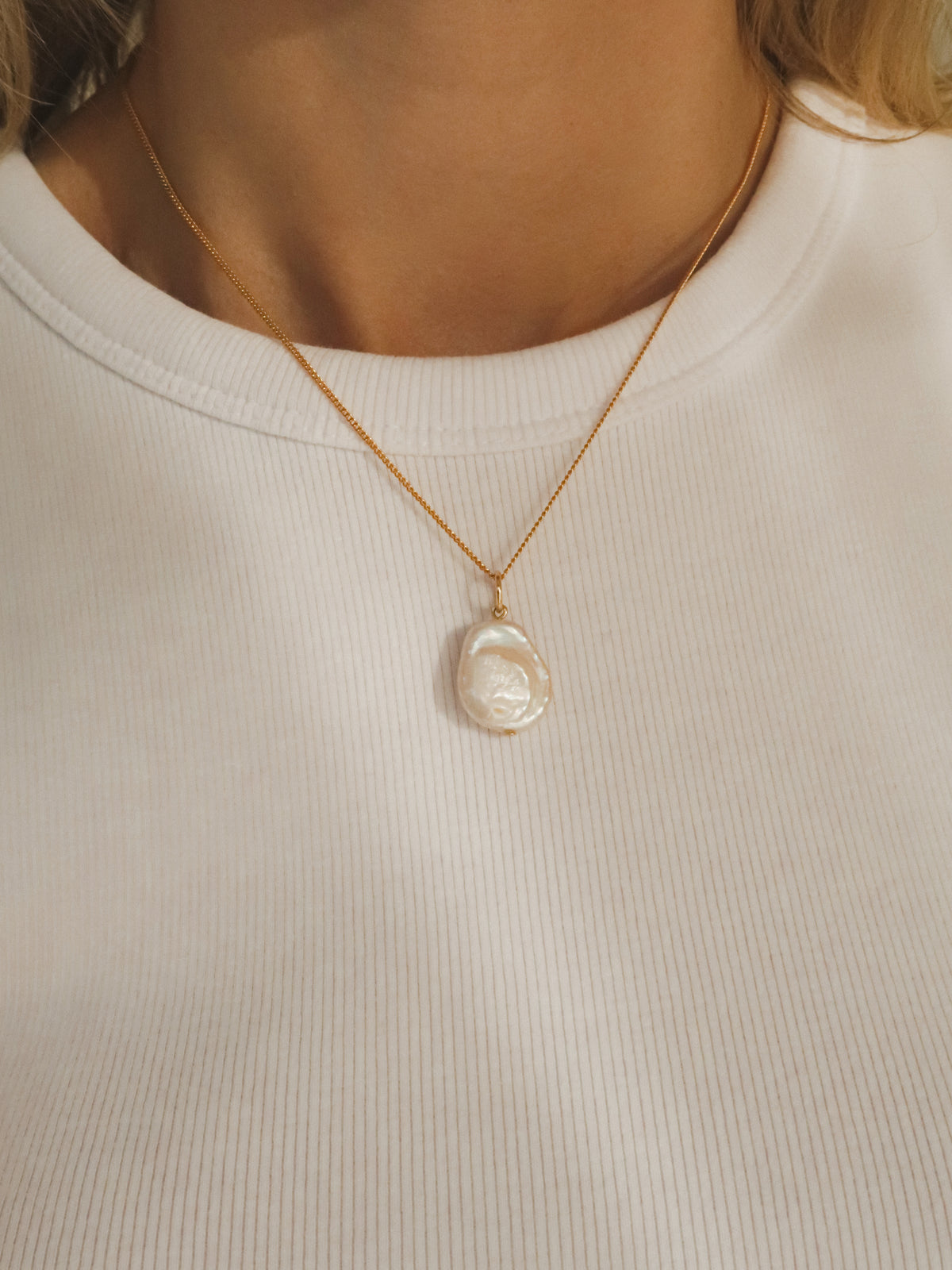 Flat pearl charm