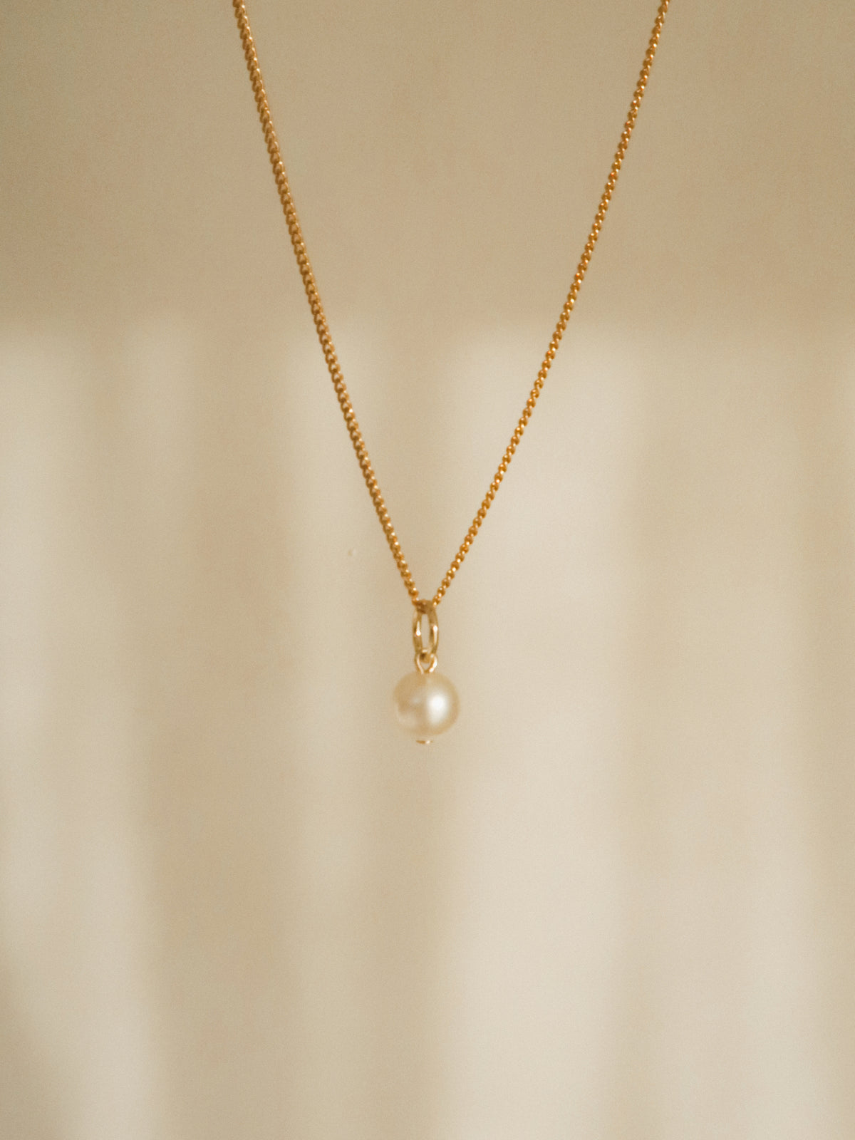 Small pearl charm