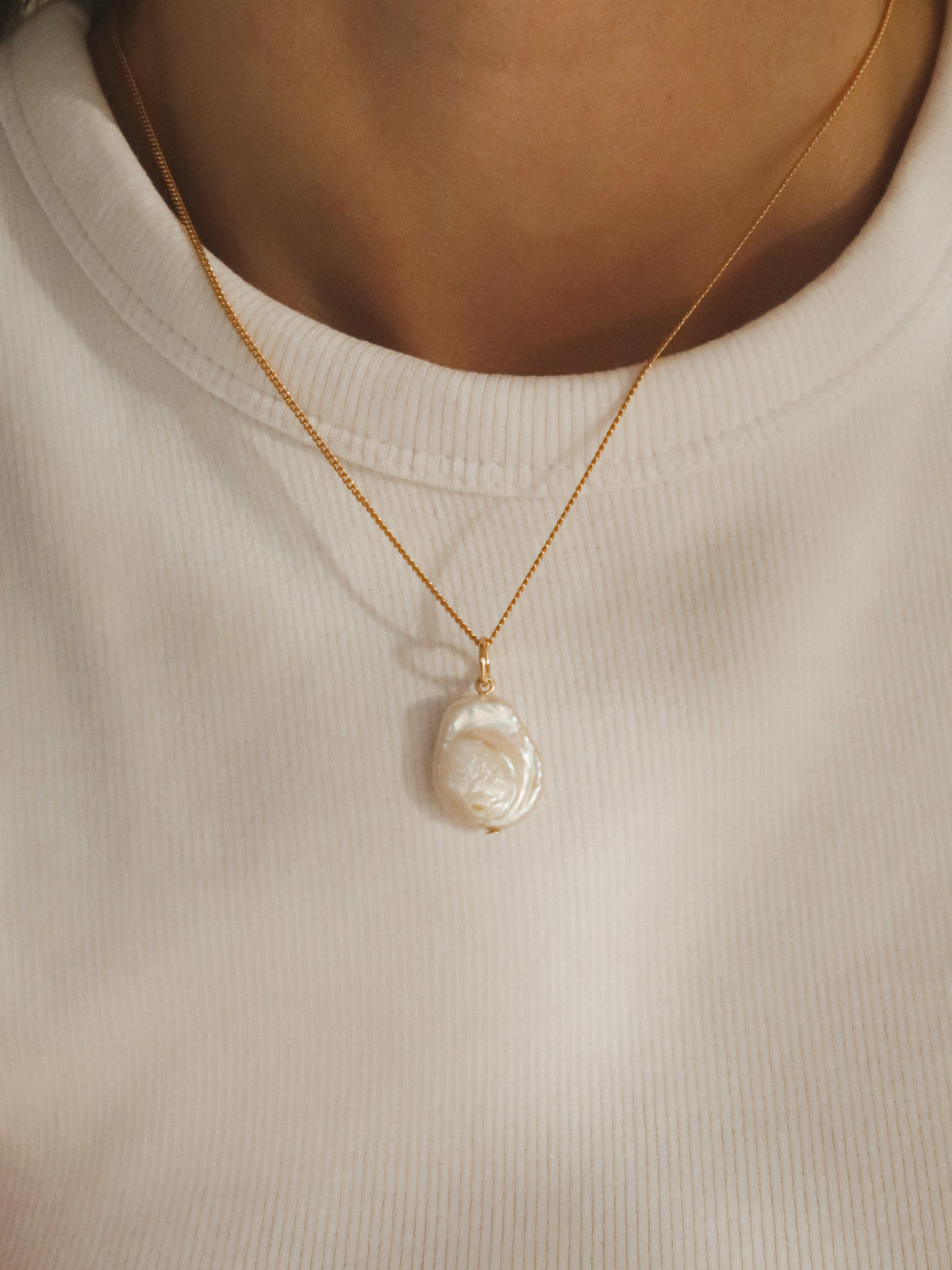 Flat pearl charm