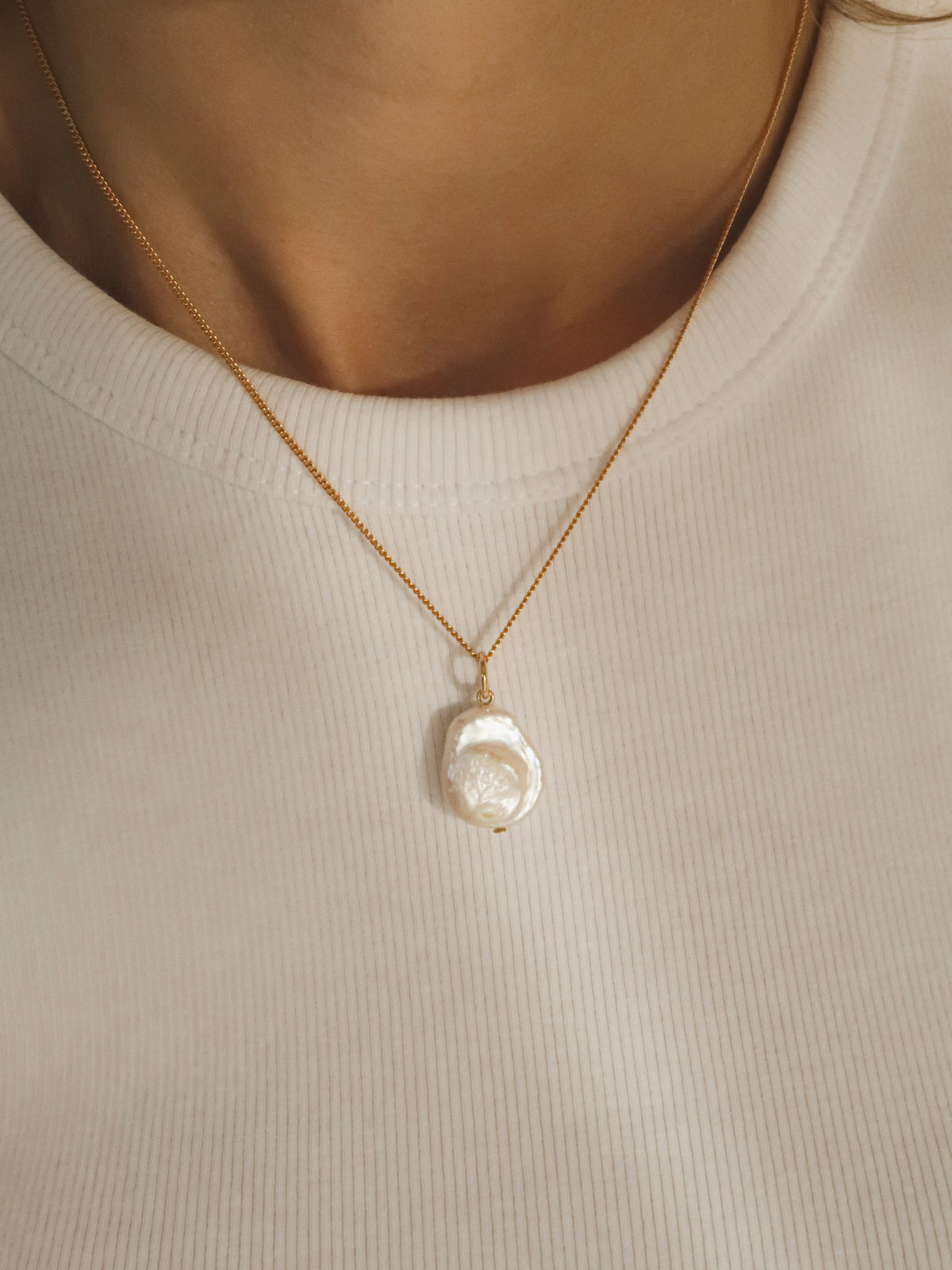 Flat pearl charm