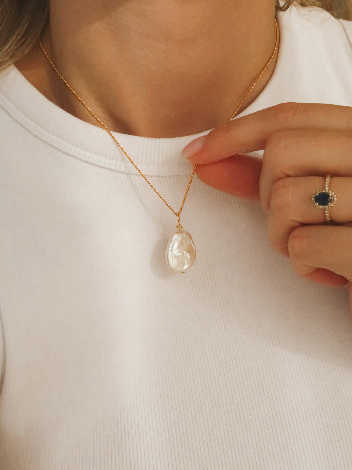 Flat pearl charm