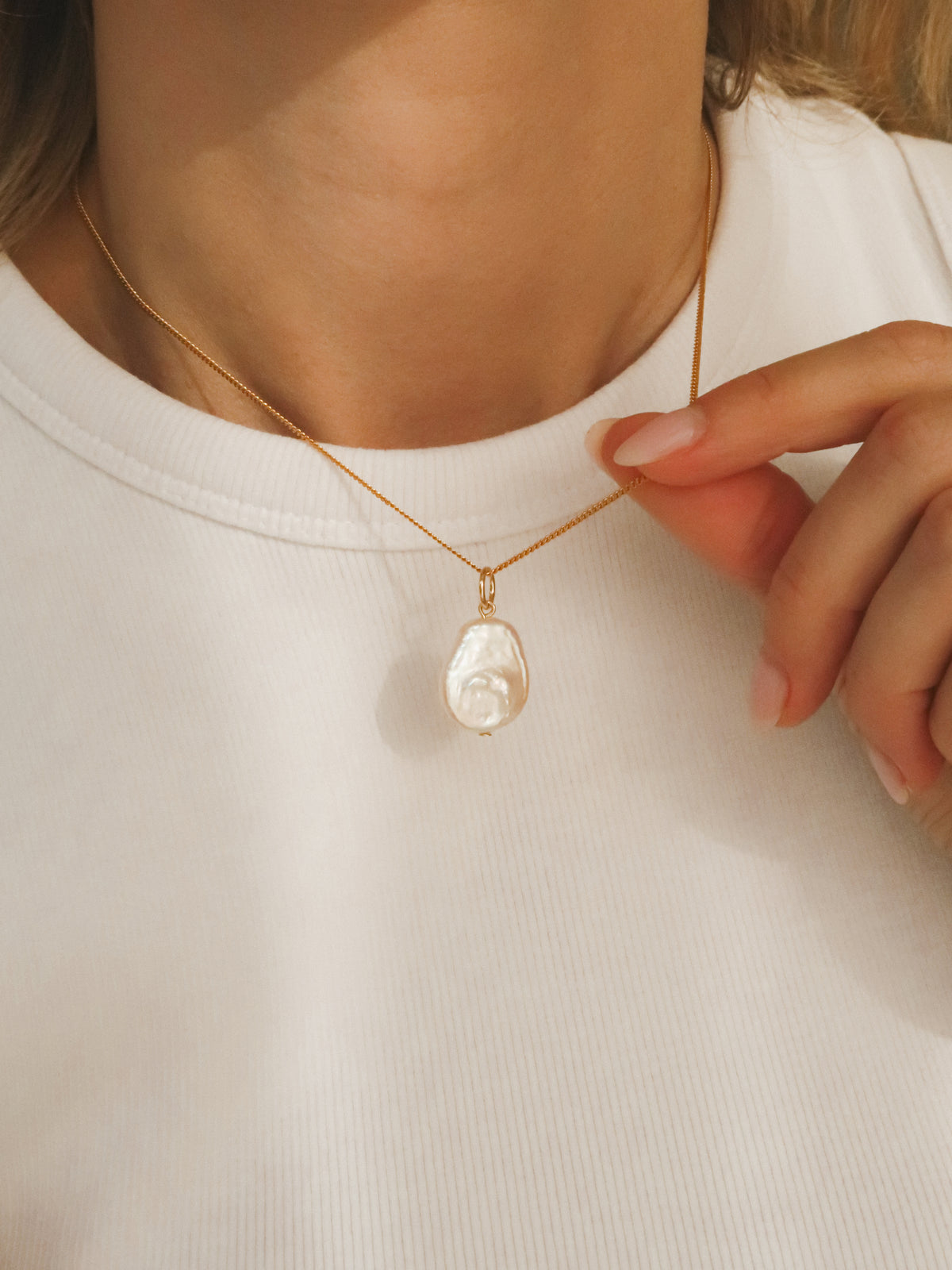 Flat pearl charm